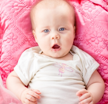 little girl with blue eyes close upの写真素材