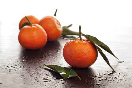 Tangerine with leavesの写真素材