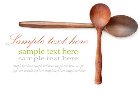 wooden spoons over white with sample textの写真素材