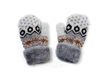 a pair of baby gray gloves with pattern on white backgroundの写真素材