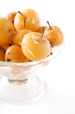 Apple compote in a glass vase on white backgroundの写真素材