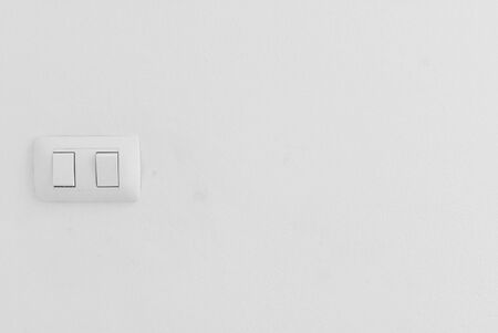 White power plug on the wall of the houseの写真素材