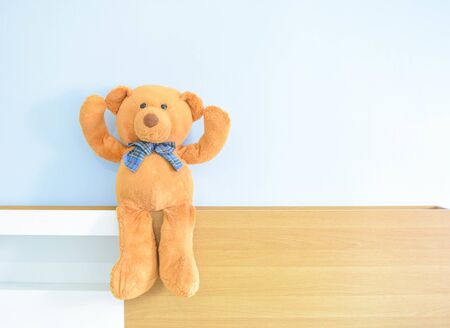 Teddy Bear on a background of blue wallの写真素材