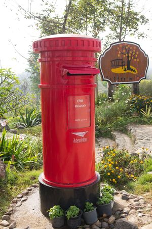 Red Post Box, a garden background.のeditorial素材