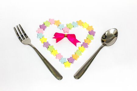 Candy hearts red ribbon on white 
