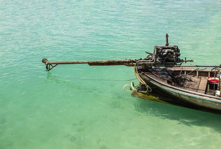 Old engine of long tail boat - outdated technology conceptの写真素材