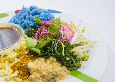 Traditional Thai food, purple rice, fresh vegetables and sauceの写真素材