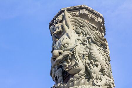 Chinese dragon stone statue Split on sky backgroundの写真素材