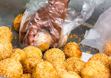 Golden fried balls covered with sesame seedsの写真素材