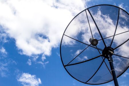 Satellite dish antennas under sky. The White Cloudの写真素材