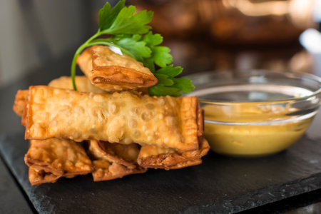 Tequenos popular food snack fried dough filled with cheese and served with avocado guacamoleの写真素材