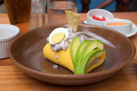Causa de octopus Peruvian buffet table Assorted food dishes gourmet sea food Peru traditionalの写真素材