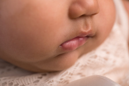 Close-up of a newborn baby's face. Shallow depth of fieldの写真素材