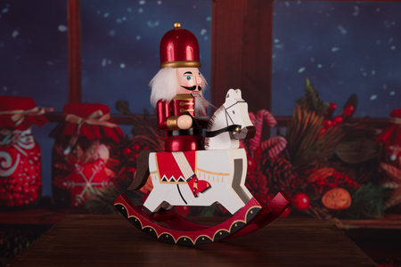 Christmas toy rocking horse with Santa Claus on the background of Christmas decorations
