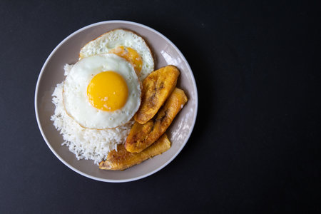 Fried egg with banana and sweet potato on rice, Thai foodの写真素材