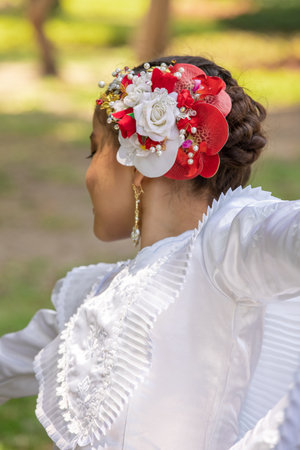 Young bride in white wedding dress with flower wreath on her headの写真素材