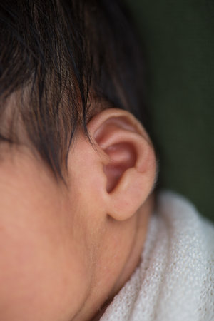 Close up of baby's ear, shallow depth of field, selective focus