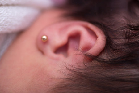 Ear of a newborn baby. Close-up. Selective focus.の写真素材