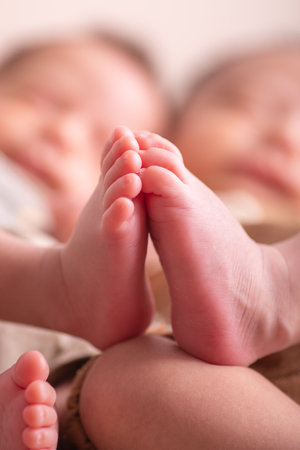 Close-up of a newborn baby's feet in mother's hands