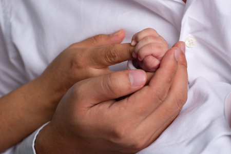 Close-up of the hands of a man and a woman holding handsの写真素材