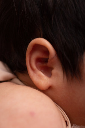Close-up of a baby's ear, shallow depth of fieldの写真素材
