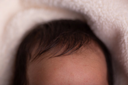 Close up of a newborn baby's face, shallow depth of fieldの写真素材