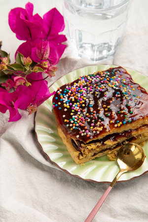 Bougainvillea cake with chocolate glaze and sprinkles