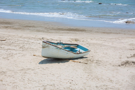 Fishing boat on the beach of the Mediterranean Sea in Israel.