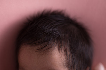 Close up of a newborn baby's head, shallow depth of fieldの写真素材