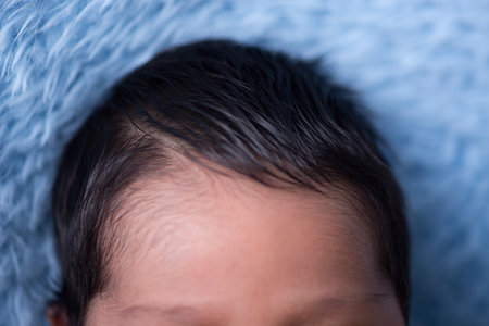 Close up of a newborn baby's head, shallow depth of fieldの写真素材