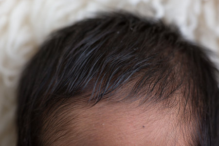 Close up of a newborn baby's hair, shallow depth of fieldの写真素材