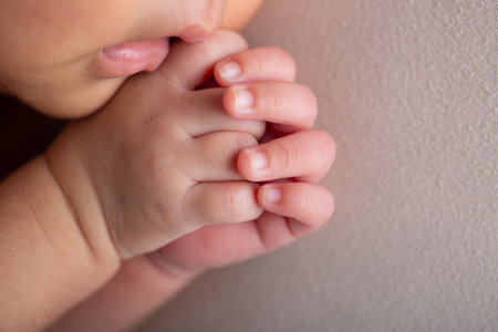Close-up of a baby's hand with a blurred background.の写真素材