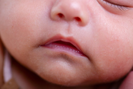 Close up of a newborn baby's face, shallow depth of field