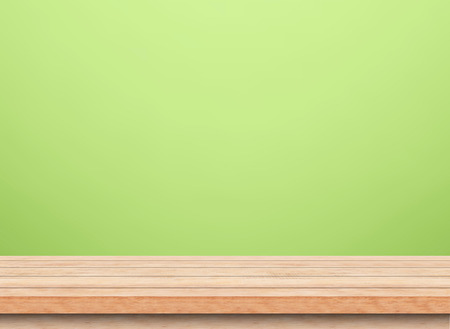 Empty wood table top with green background, Template mock up for display of product.の写真素材