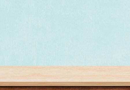 Empty brown wood table top on blue concrete background, Used for display or montage your products.の写真素材