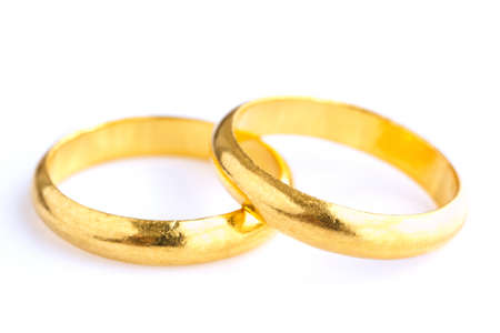 Gold wedding rings on white background