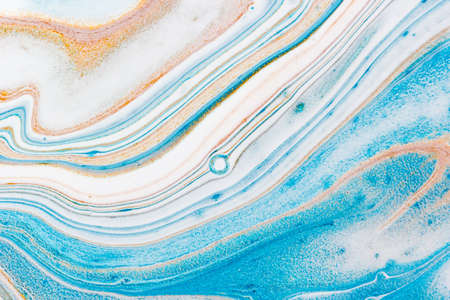 Gold and blue liquid marble background. Used in design for skin tile ,wallpaper, interiors backdrop....
