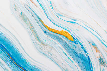 Gold and blue liquid marble background. Used in design for skin tile ,wallpaper, interiors backdrop. Picture high resolution. Luxurious backgroundの写真素材