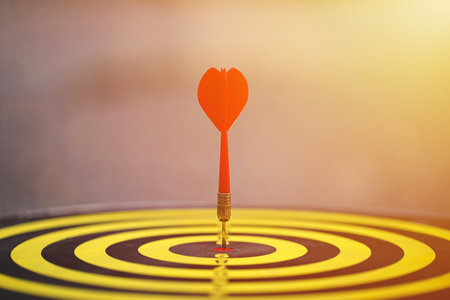 Red dart hit to center of dartboard. Concepts of Business marketing goal, Successful business. Business targeting.の写真素材
