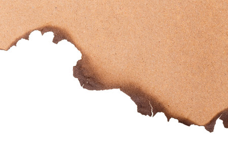 Burn brown paper half isolated on white background with clipping pathの写真素材