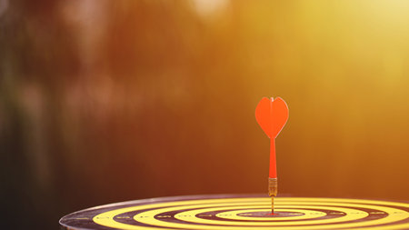 Red dart hit to center of dartboard. Concepts of Business marketing goal, Successful business. Business targeting.の写真素材