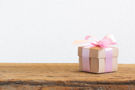 Brown gift box on wood table background