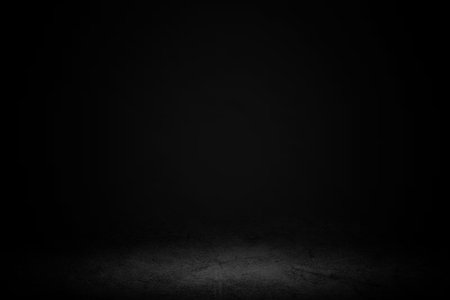 Product showcase with spotlight. Black studio room background. Use as montage for product displayの写真素材