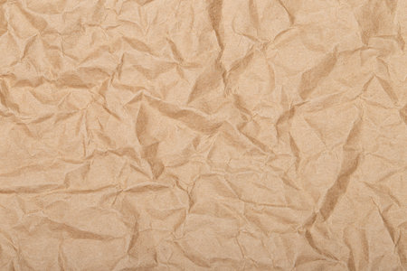 Brown wrinkle recycle paper background, Brown Craft crumpled paper, cardboard background.の写真素材