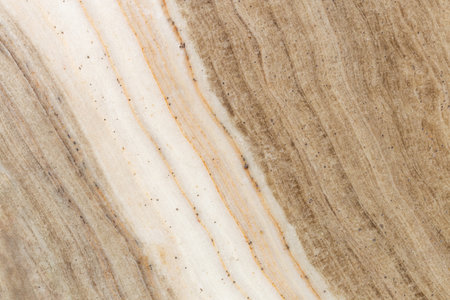 High-resolution brown marble texture with soft natural veins and creamy beige tones, perfect for interior design, surfaces, and luxury backgrounds.の写真素材