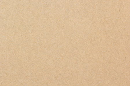 Brown kraft paper texture ideal for eco-friendly packaging, craft projects, and natural design themes.の写真素材