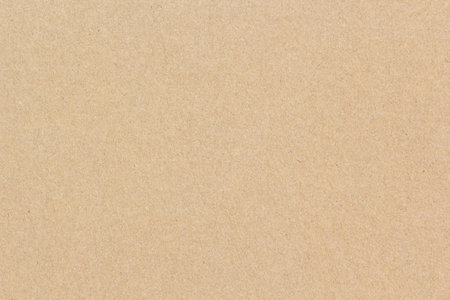 High-resolution brown recycled paper surface showing natural fiber texture, perfect for eco-friendly backgrounds, packaging, or craft design projects.の写真素材
