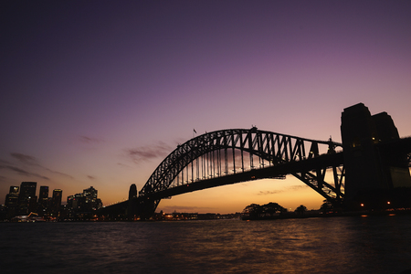 silhouette view of Sydney Harbour Bridge on colourful twilight sky.のeditorial素材