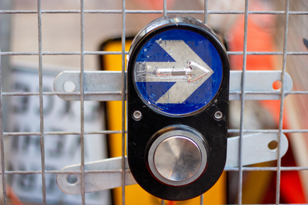 Sydney traffic light button, Traffic light pedestrian crossing buttons hangs on metal construction netの写真素材
