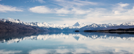 panorama of New Zealand snow mountain reflect on turquoise lake with blue skyの写真素材